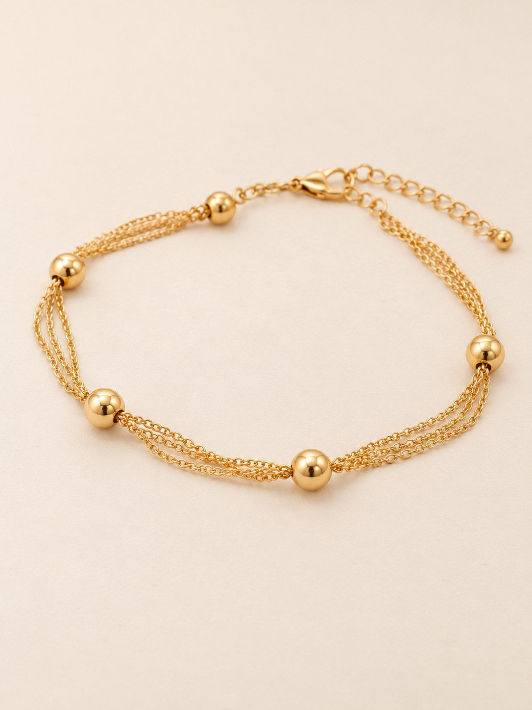 Tobillera Triple Balines Dorado · Hero · Anturia