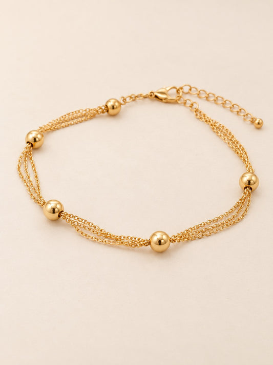 Tobillera Triple Balines Dorado · Hero · Anturia